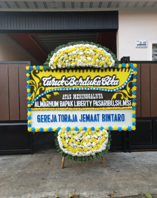 Papan Bunga Duka di Lotu